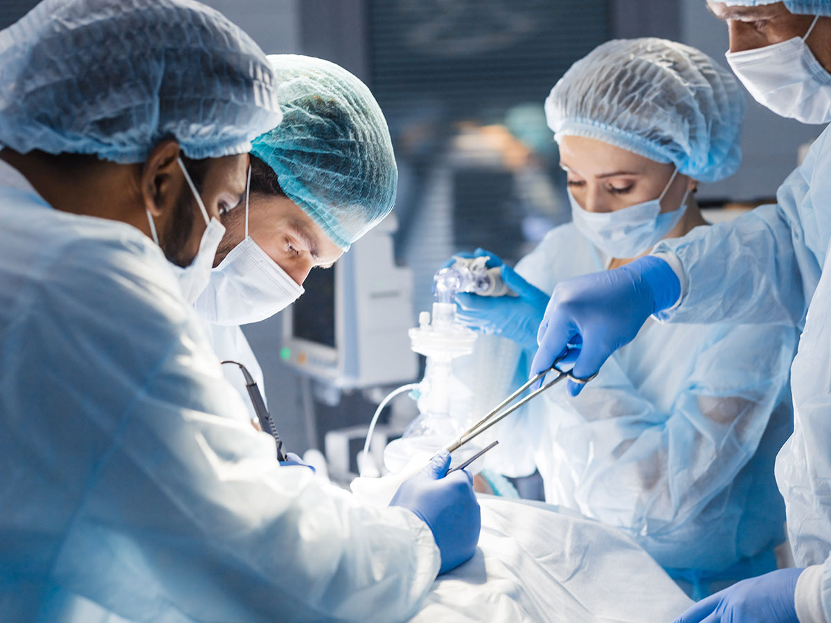 One Marketing - Client Canadian Society of Plastic Surgeons - 4 doctors performing an operation. All wearing masks.